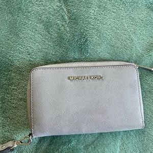 Michael Kors Grey Wristlet purse near perfect condition